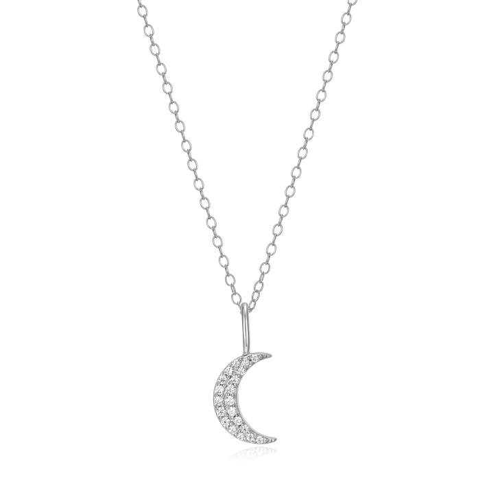 Silver crescent moon necklace with small diamonds on a white background