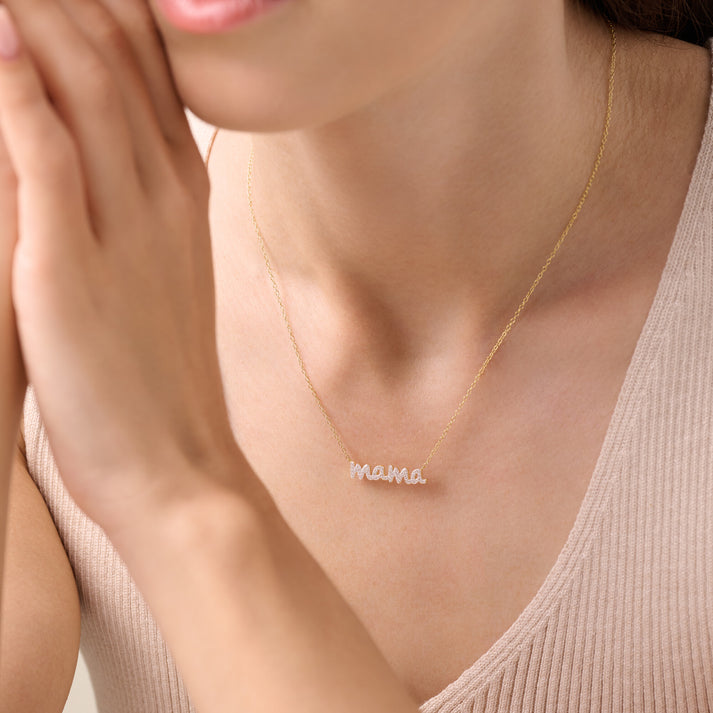 Gold-plated sterling silver necklace with  'mama' in lab diamonds. 16" chain   on model.