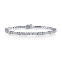 A beautiful Tennis bracelet set in Platinum  bonded sterling silver featuring 59 Simulated Diamonds. 6.5 CTW