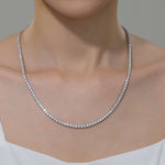 Model wearing 14.5 CTW Classic tennis Necklace - 129 Simulated Diamonds set in Platinum bonded Sterling Silver 