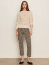 A woman wearing a leopard print mid-rise cropped jean 