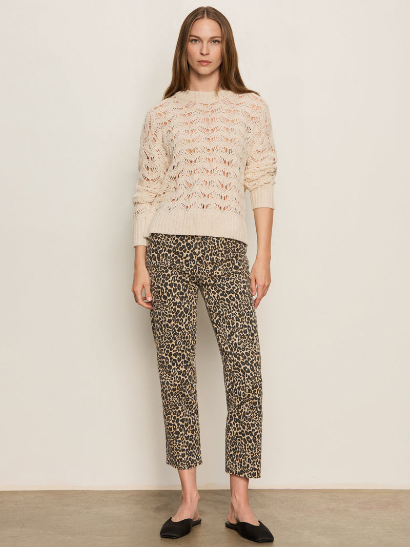 A woman wearing a leopard print mid-rise cropped jean 