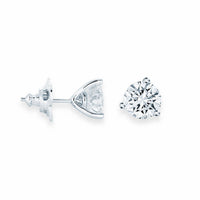 Two diamond earrings on a white background