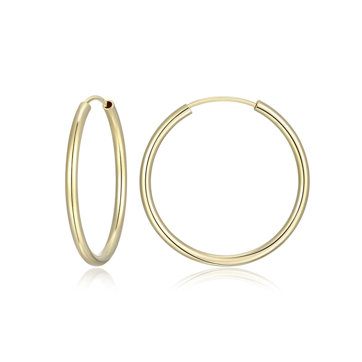 Large hoop earrings with a slim profile in Gold plated sterling silver.