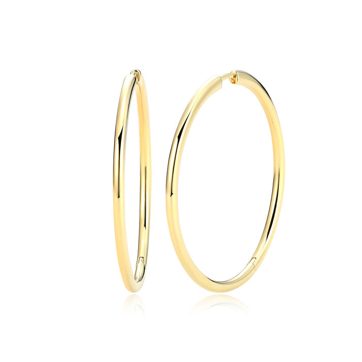 Gold hoop earrings on a white background