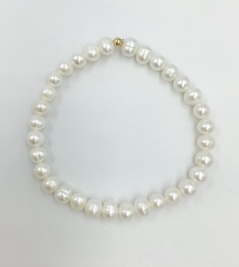 Bracelet made with  5mm White  Freshwater Pearls strung on an elastic stretchy cord  Bracelet 