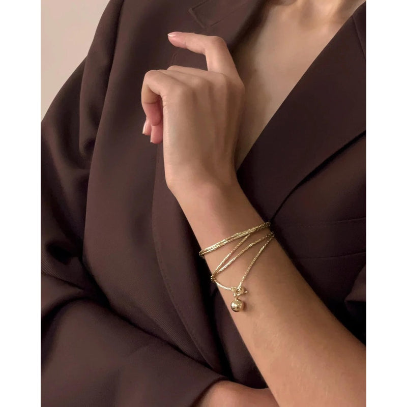 Constance wrap worn as a bracelet 