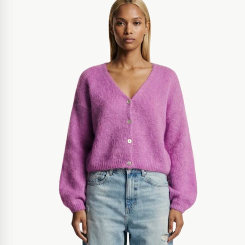 A beautiful alpaca LS Cardigan in  Perley Purple with light denning jeans on model 