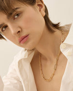 A modern Gold paperclip necklace worn by model.- jenny Bird 
