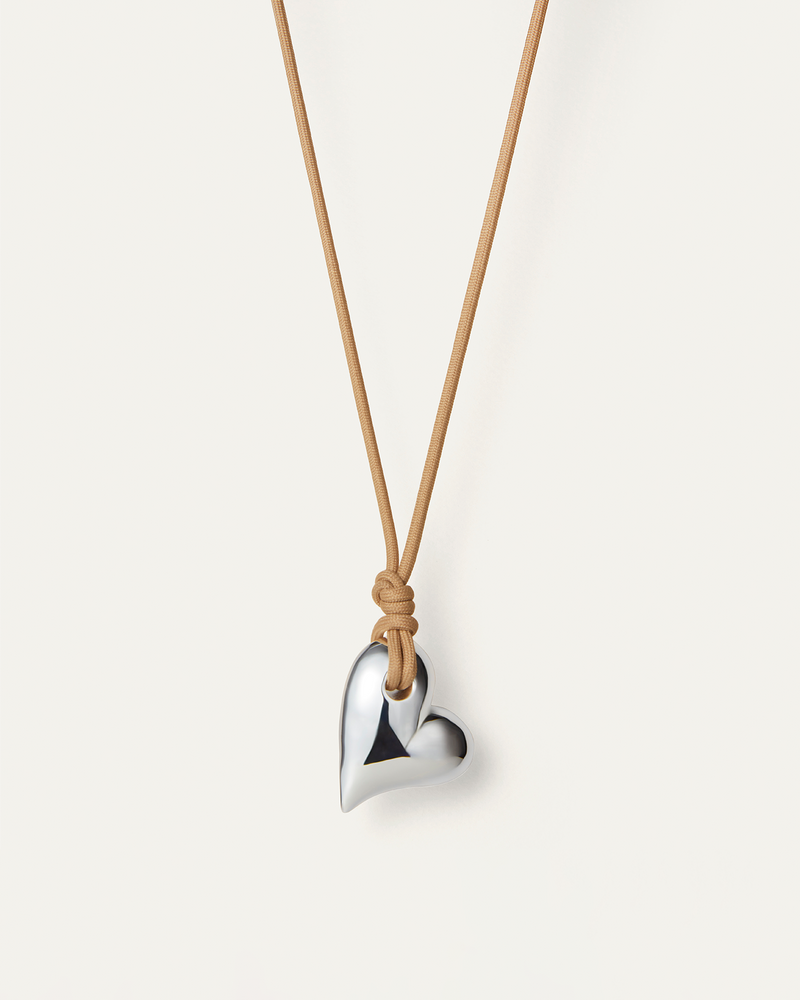 Front view of Large Silver heart on a cord by jenny Bird 