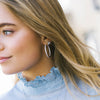 Model wearing Bovalino  Earrings in sterling silver with CZ's by Sif Jakobs at Hickox jewelers & Lifestyle 