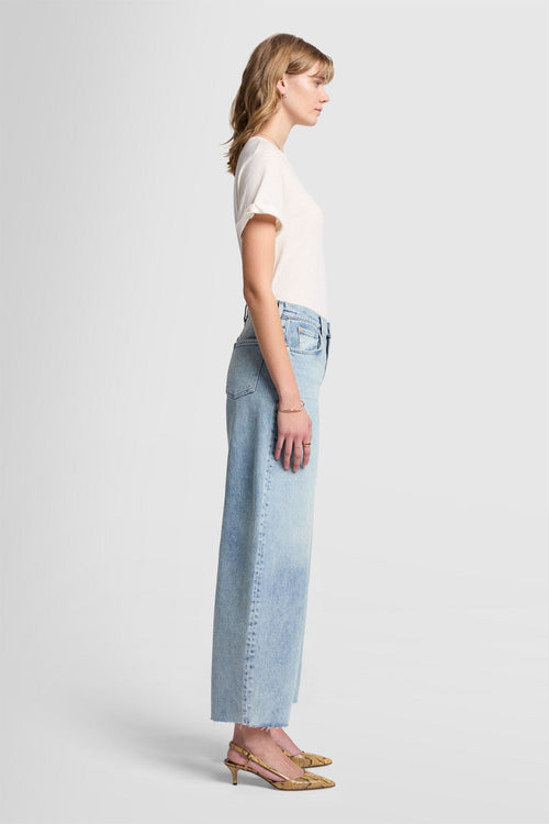 Side view of the Bonnie Curvy linear Jean: high waisted with a 30" inseam and raw hem 