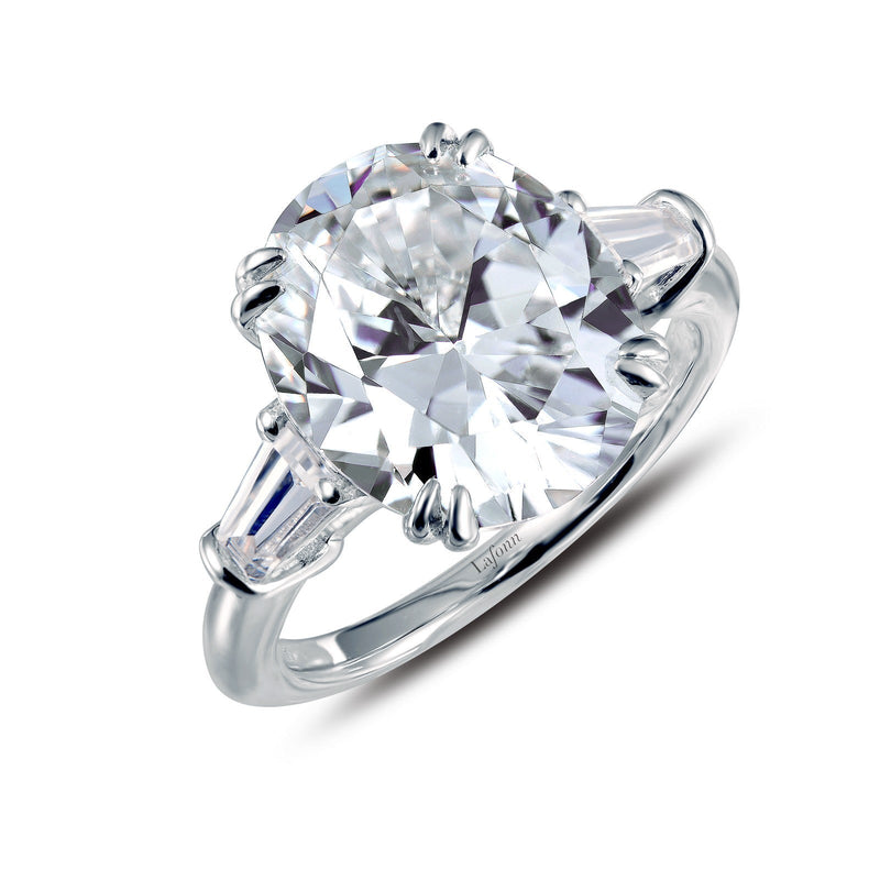 Wow a stunning three stone ring with a Large oval simulated diamond in the center with baguette's on each side - CTW 5.75