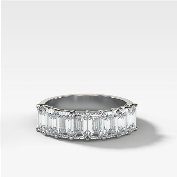 Lab Diamond Eternity band ring with emerald-cut stones on a white background