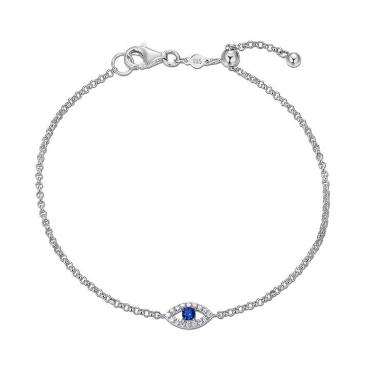 Sterling Silver bracelet with lan diamonds and a lab created sapphire evil eye charm. 