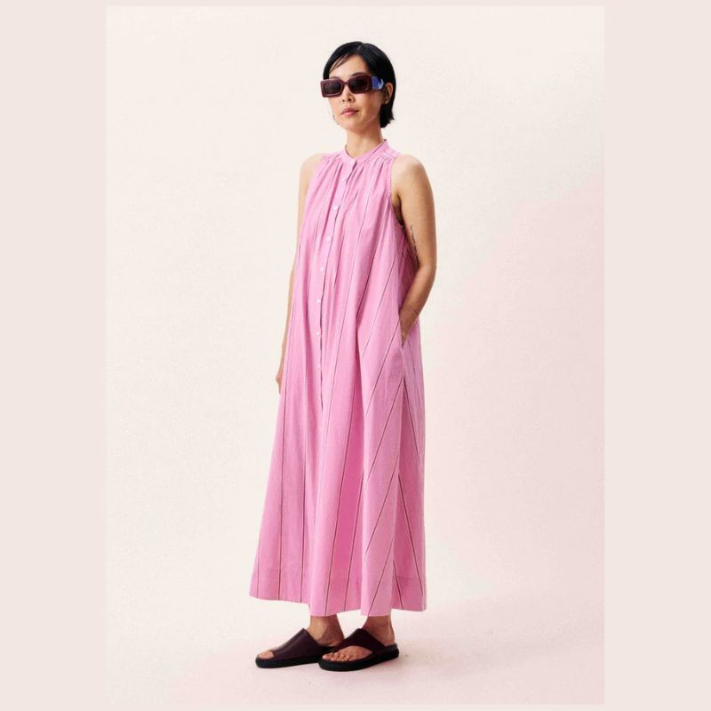 A Long, sleeveless dress with central button fastening in pastel pink							
