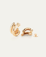 The Florence Earring is a dramatic and voluminous statement hoop earring in high-polish gold. It looks like two earring hoops are stacked together, and has a new flat backing for ease of wear.