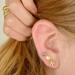 Model wearing Handcrafted gold round Delicate Hammered Stud earring   by Anne Sportun 