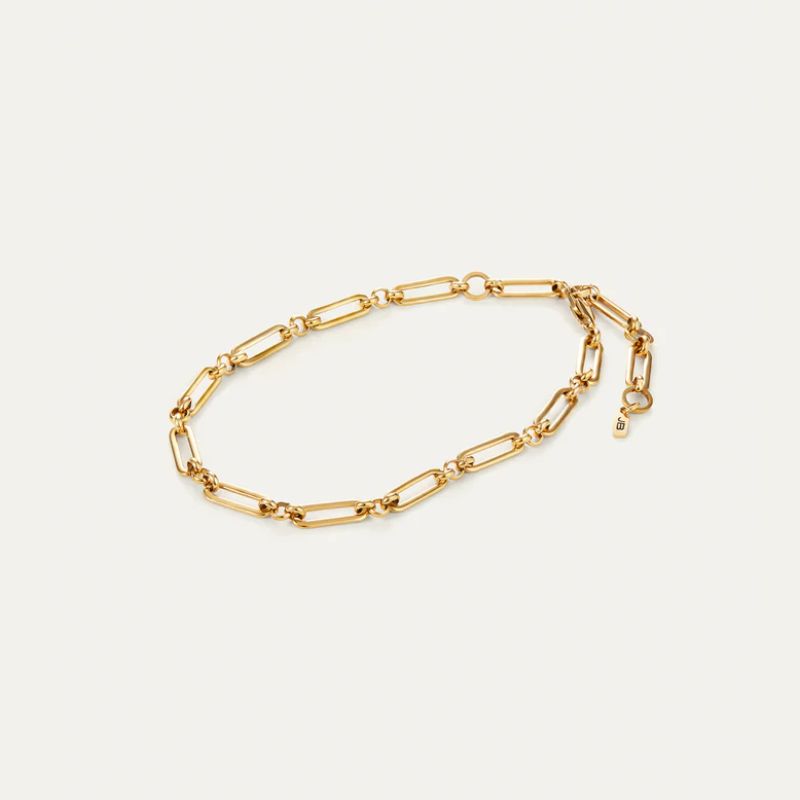 Gold Paper Clip chain  link Anklet on a light beige background