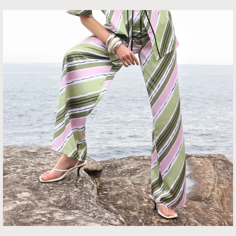 Relaxed fitting  Pant with bias stripes in Pink and green features a contrasting elastic waistband with drawstring .