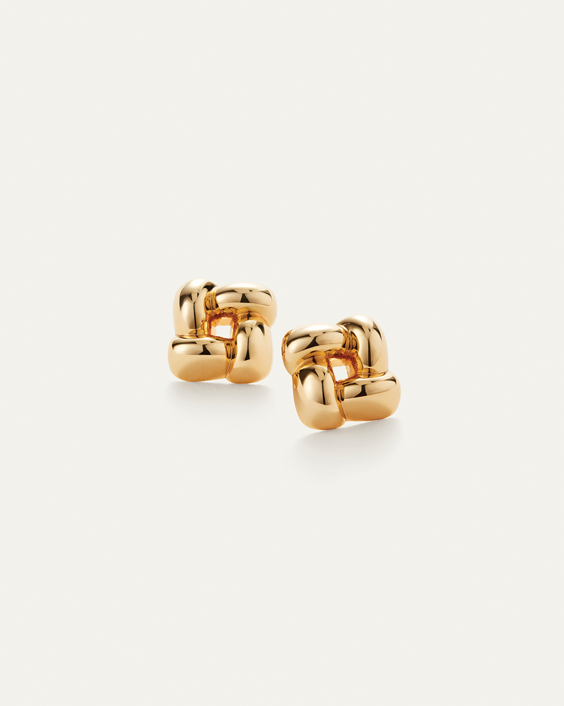Pair of gold hoop earrings on a white background