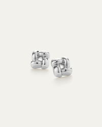 Pair of silver hoop earrings on a white background