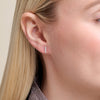 Close-up of a model wearing Lab diamond bar earrings set in rhodium plated sterling silver 