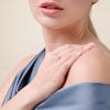 Close-up of a woman wearing a M by Monte Luna with 4 rows of Lab diamond ring. 