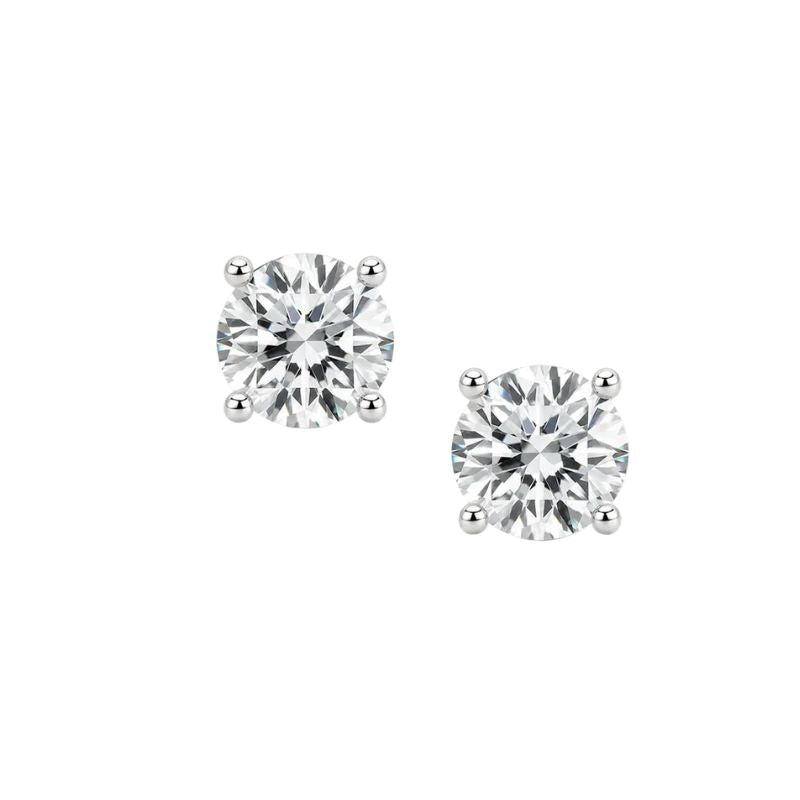 A pair of lab Diamond s4 prong martini set stud earrings set in 14K gold on a white background 