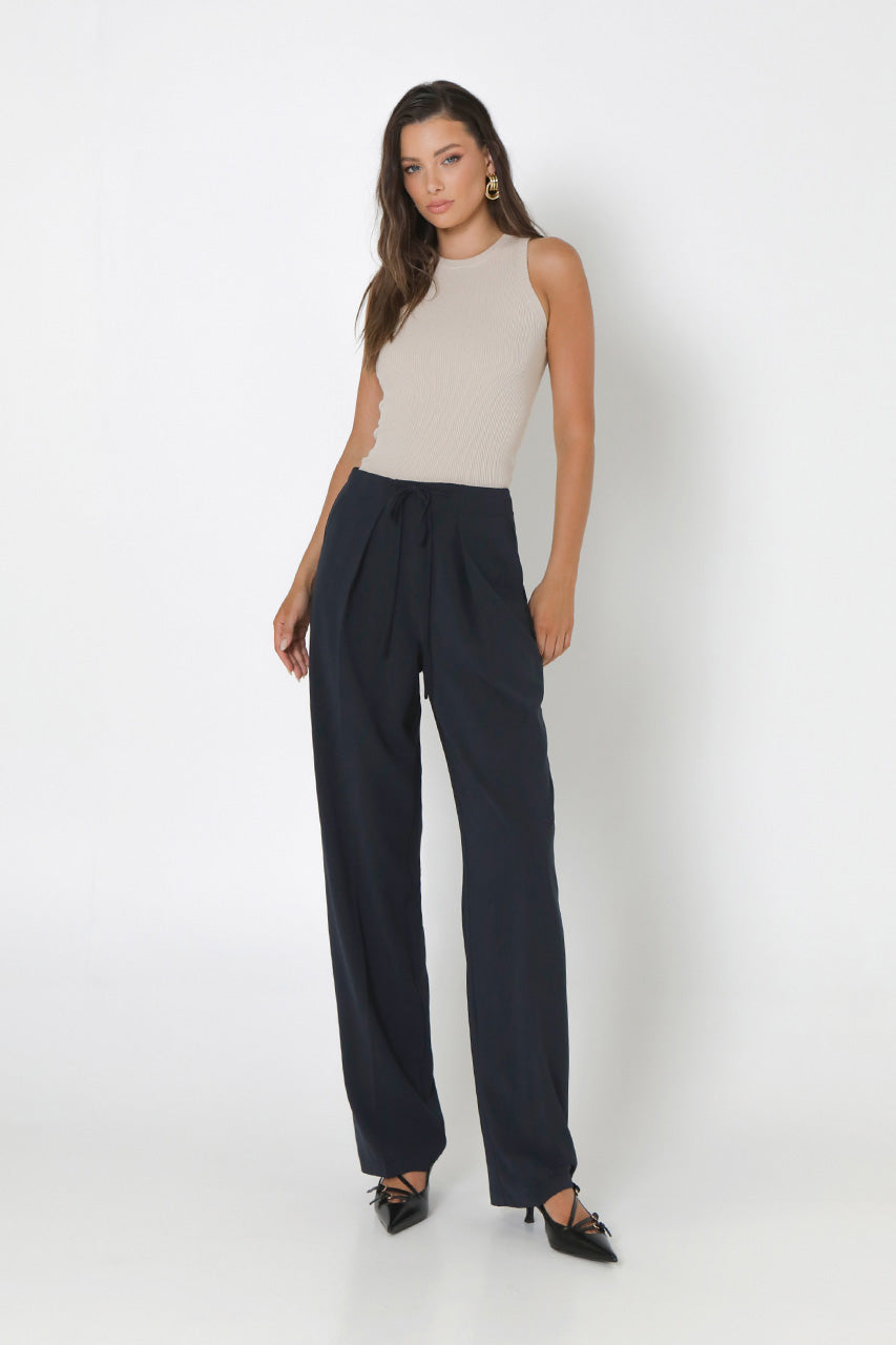 Front view- Wynter Pants with a pleated front and a self tie favric detail - Navy 