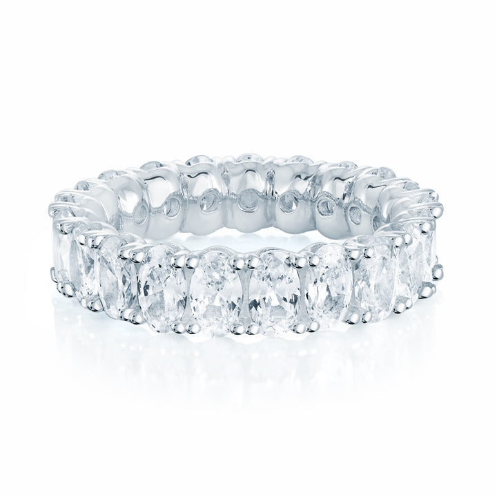 Oval Cut CZ eternity band ring in sterling silver on a white background 