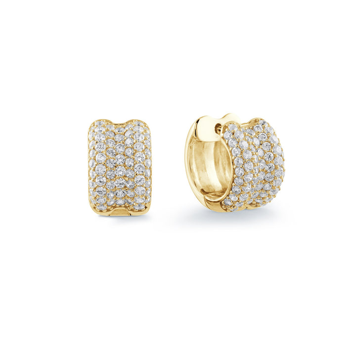 A pair of gold huggie hoop earrings paved with small clear stones, shown from front and side angles on a white background.