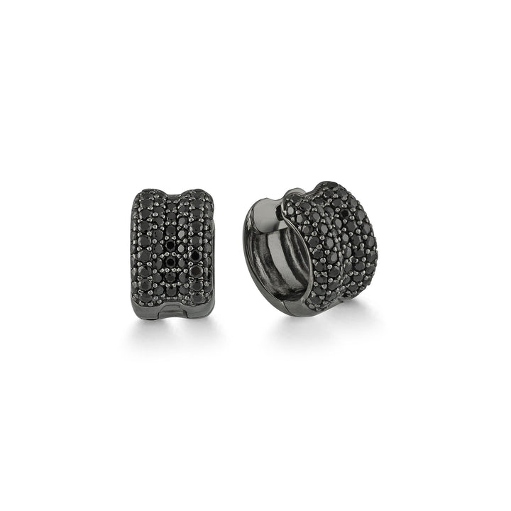 A pair of small hoop earrings in dark gunmetal or blackened silver-tone metal, each covered in rows of small round dark stones, shown on a clean white background.