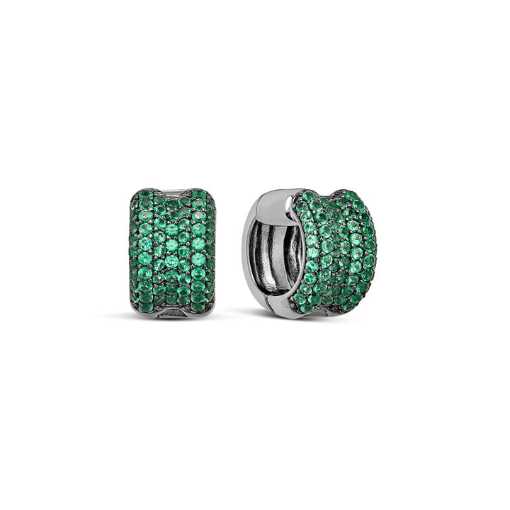 A pair of silver huggie hoop earrings paved with round green gemstones, shown from both front and side angles on a white background.