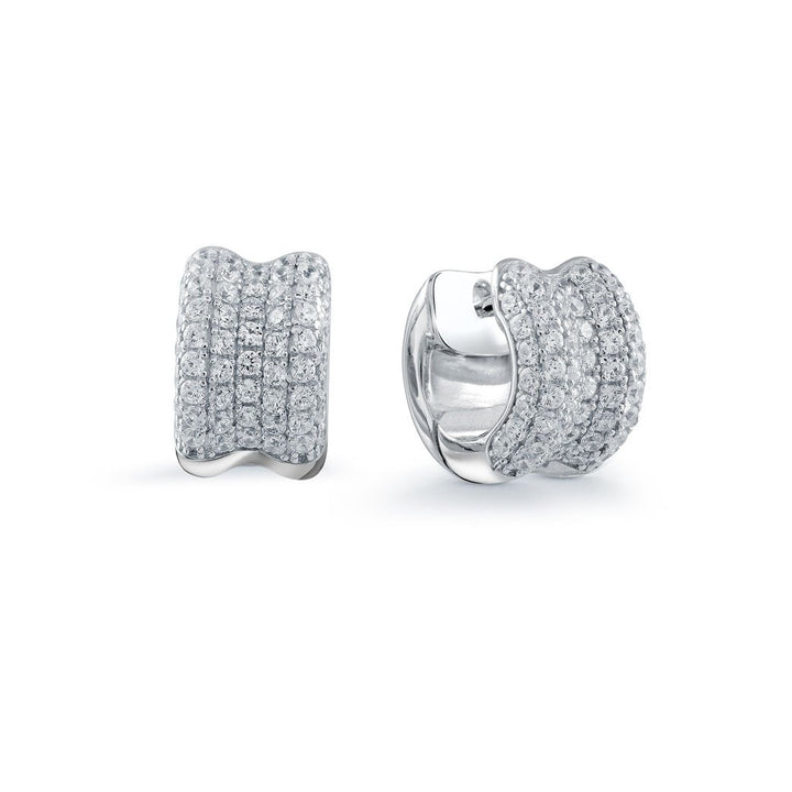 A pair of silver huggie hoop earrings paved with clear cubic zirconia stones, shown from both front and side angles on a white background.