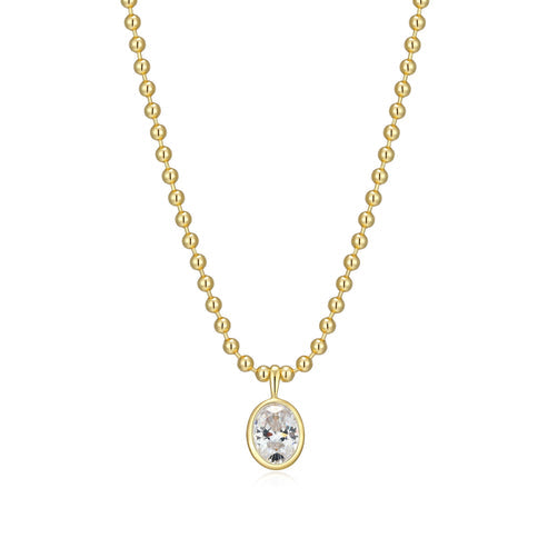 Gold necklace with a bezel set  Oval  Cubic Zirconia pendant on a white background