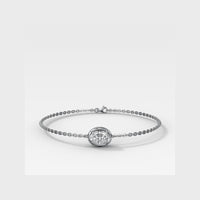 A delicate white gold chain bracelet featuring a central round bezel-set diamond, displayed on a clean light gray background.