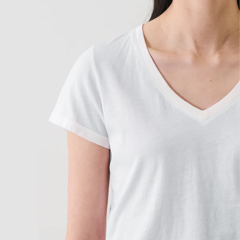 Reverse Spray very pale blue t-shirt worn by a person on a plain white background