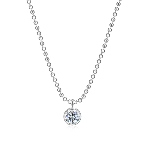 Silver ball necklace with a round CZ bezel set  pendant on a white background
