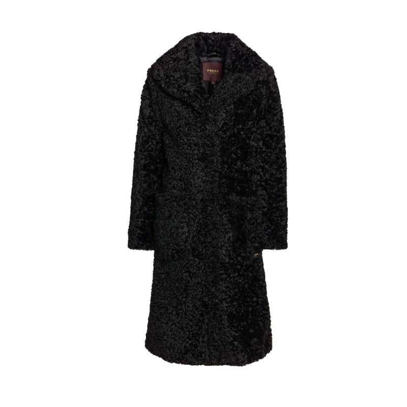 A stunning 3/4 length coat in a super soft shearling faux fur . Mde in Canada 