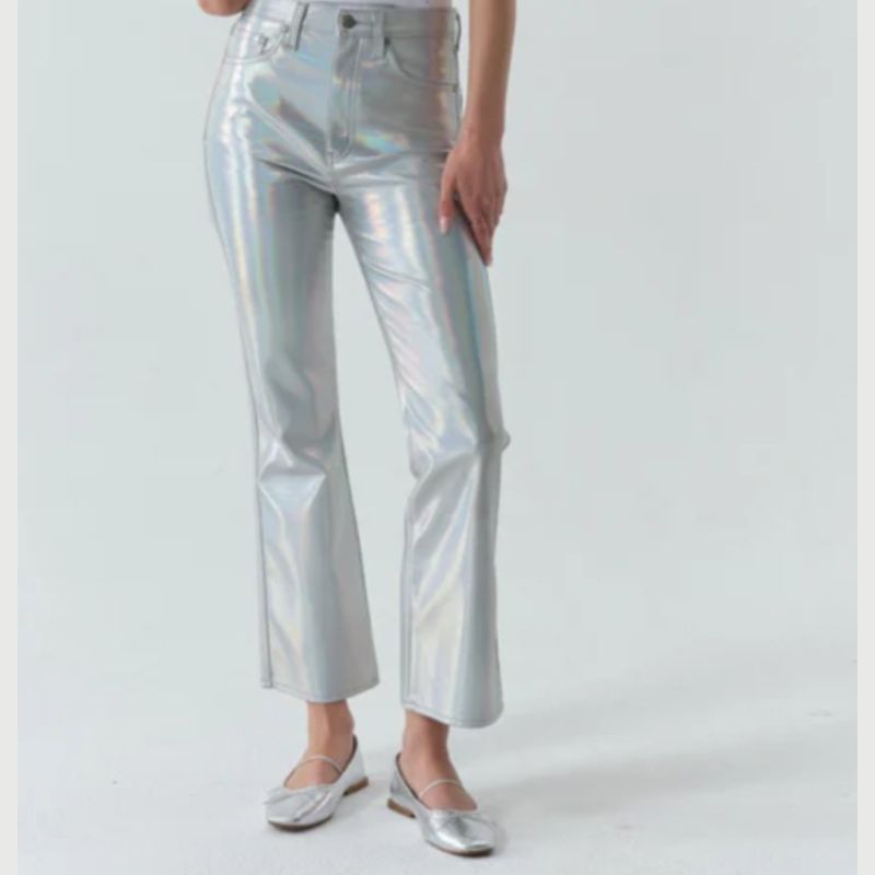 in a striking silver flash finish these pants by DAZE feature a slim leg fit  witha flared bottom; a zip closure and 5 pocket design 