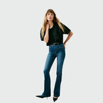 Authentic blue indigo Shapewear jeans by Spanx- form fitting with a flare leg 