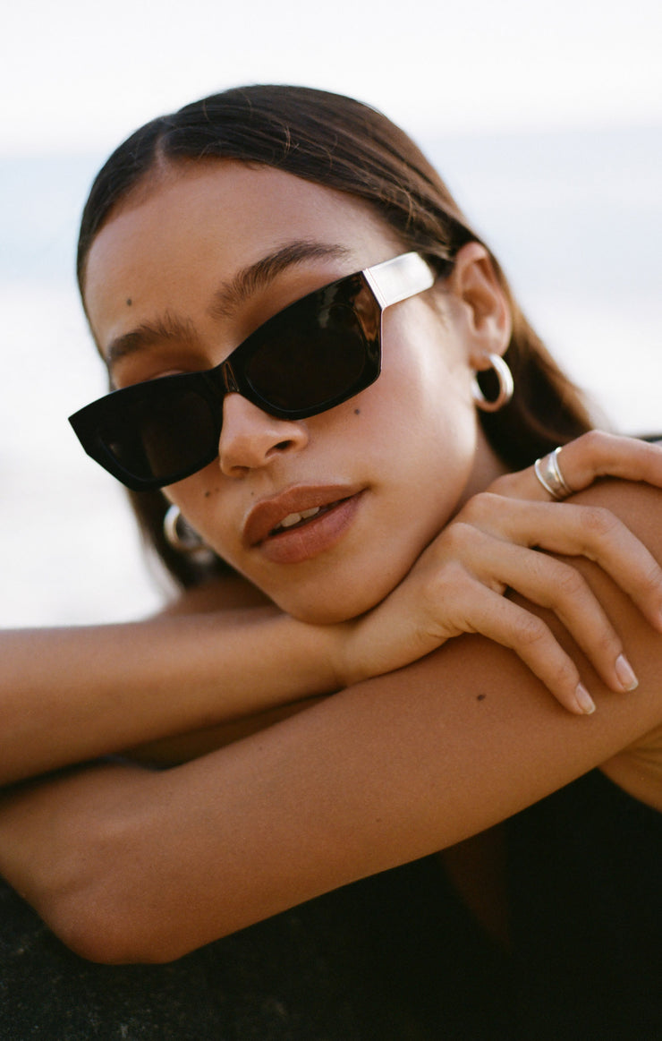 Model wearing SUNKISSED Z SUPPLY Sunglasses in Black Polished Gloss 