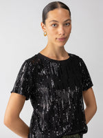 A front view of the perfect tee in black all over sequins - crewneck and short sleeves.