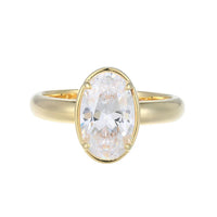 Gold ring with a large diamond on a white background