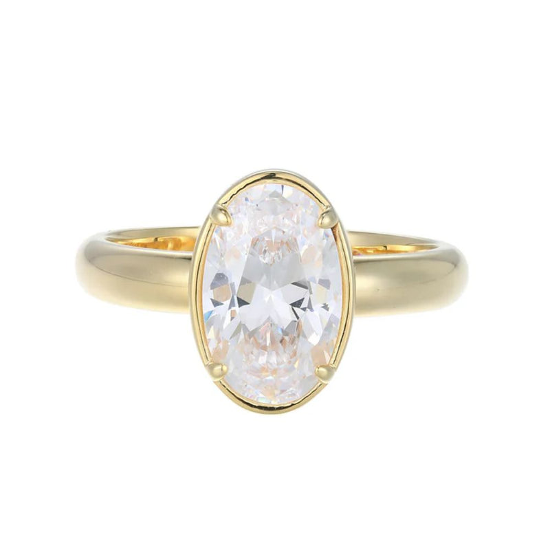 Gold ring with a large diamond on a white background