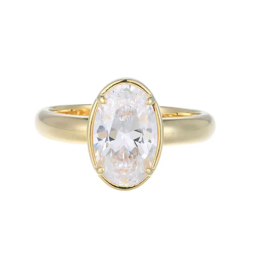 Gold ring with a large diamond on a white background