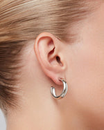 Basic Medium silver tone hoop earrings.