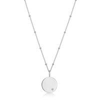 Engravable Silver round disk pendent with a small CZ  on a chain 