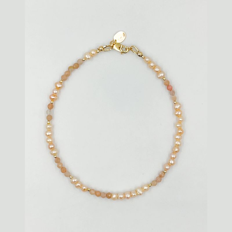 Hand beaded  Anklet with moonstone beads, featuring a gold clasp on a light gray background